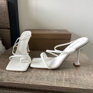 White strappy heeled sandals